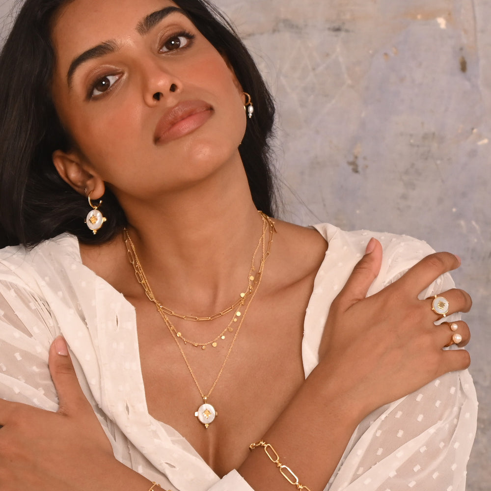 Murkani |  Oval Earrings with Mother of Pearl | 18KT Yellow Gold Plate